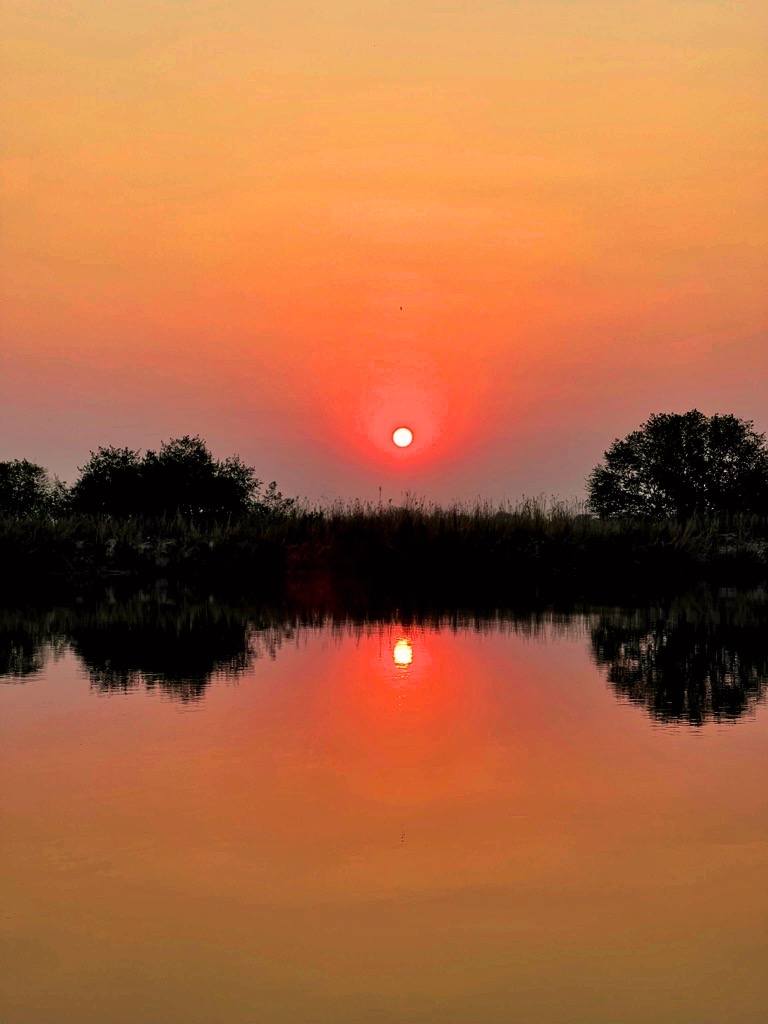 Tramonto sul Fiume Okavango